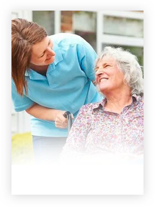 Companion caregiver smiling with elderly woman